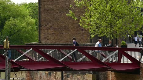 Walking-over-the-bridge,-Kings-Cross,-London,-United-Kingdom