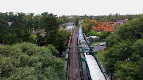 Damaged-train-on-tracks-after-accident-in-Argentina,-forward-aerial