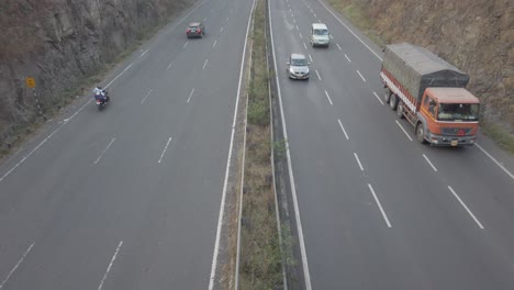 Multi-lane-Mumbai-Bangalore-highway-traffic-near-Pune,-road-travel-in-India