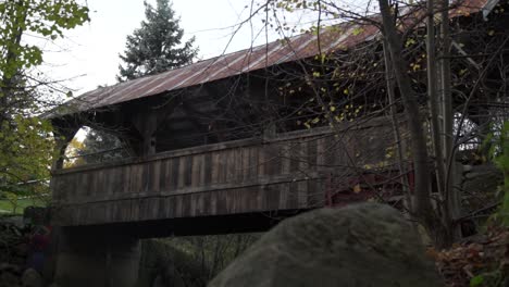 Cullen-Central-Park-Wooden-Footbridge-Over-a-River-in-Whitby,-Canada