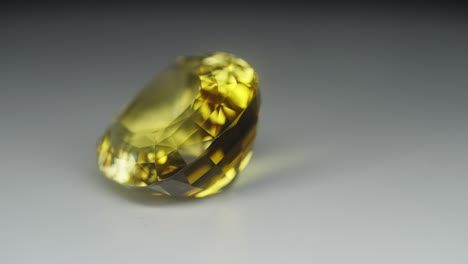 Polished-yellow-gemstone-rotates-and-sparkles