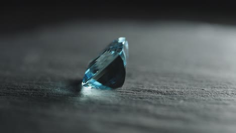 Polished-blue-gemstone-rotates-and-sparkles