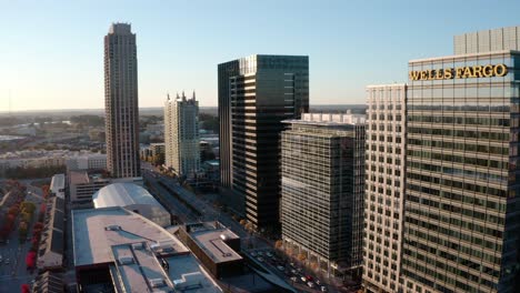 Aerial-of-the-Wells-Fargo-Bank-corporate-skyline-office-buildings-at-sunset