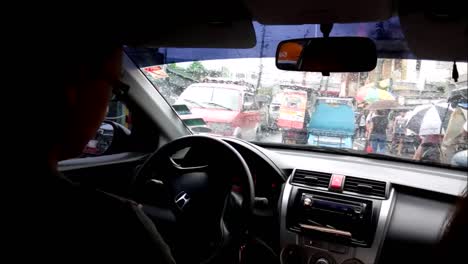 ANTIPOLO-CITY,-PHILIPPINES-–-JULY-9,-2019:-Time-lapse-video-shot-inside-a-car-of-a-man-driving-with-his-family