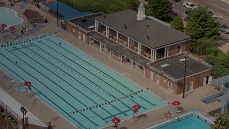 Aerial-overhead-view-of-swimmers-in-Clayton-public-pool-in-St
