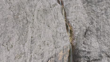 Cinematic-aerial-tilt-down-view-of-Murfreit-waterfaall-near-Passo-Gardena