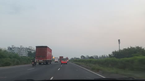 timelapse-where-many-trucks-cars-and-bikes-are-going-on-the-road-and-there-are-also-many-big