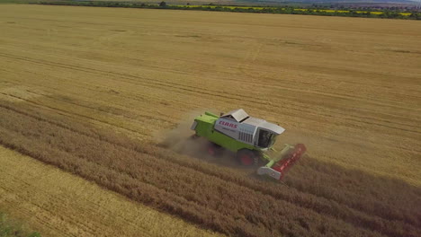 Flying-above-reaping-harvester-in-a-hot-weather