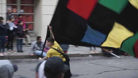 Man-with-flag-at-llamadas-parade.-Uruguay.-Handheld