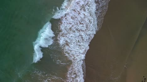 Beautiful-Beach-with-Ocean-Waves-from-an-Aerial-Drone-Ascending-with-Top-Down-View