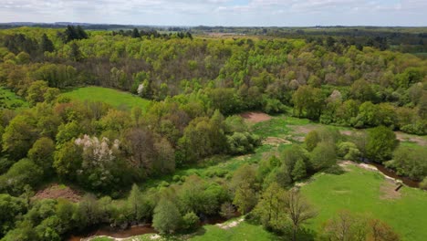 Flying-over-green-meadows-and-Glane-river-in-France