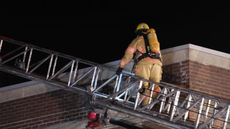 Firefighters-Climbing-Ladder-To-Abandoned-Building-Fire-At-Crémazie-Boulevard-In-Montreal