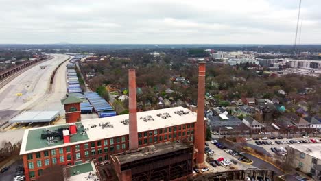 Aerial-of-Atlanta-Cabbagetown-community-housing-and-Intown-neighborhood,-Fulton-Cotton-Mill-Lofts-and-Hulsey-shipping-Yard