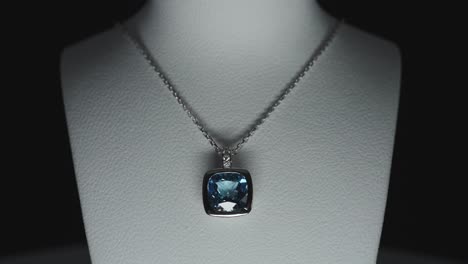 Blue-gemstone-on-a-necklace-on-a-bust