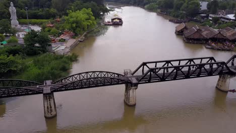 Aerial-Drone-shot-flying-over-the-Bridge-Over-The-River-Kwai,-Thailand-Death-Railway,-Kanchanaburi,-Thailand