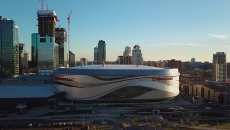 Drone-flying-over-the-Edmonton's-Rogers-Place-venue-at-sunset-in-fall