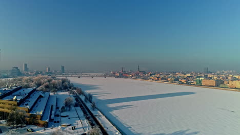 Winter-aerial-panorama-of-Riga-above-frozen-river-Daugava-in-Latvia