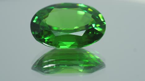Polished-green-gemstone-rotates-and-sparkles