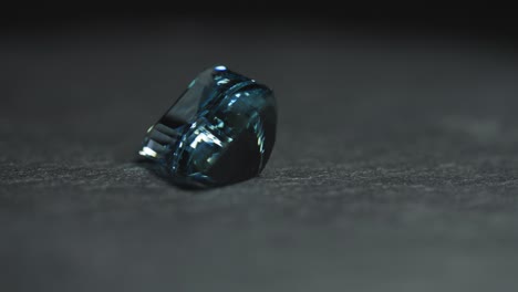 Polished-blue-gemstone-rotates-and-sparkles