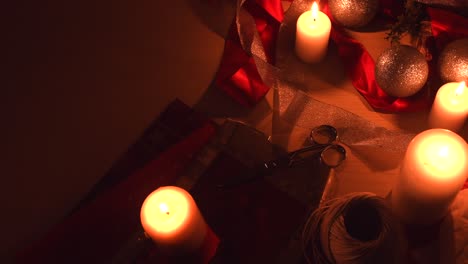 Christmas-background-with-candles-and-wrapping-equipment