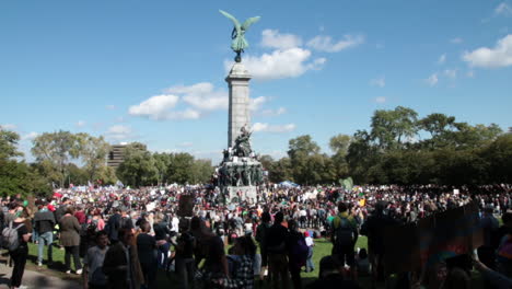Large-gathering-of-people-at-Mount-Royal-park-statue-during-climate-change-protest-march