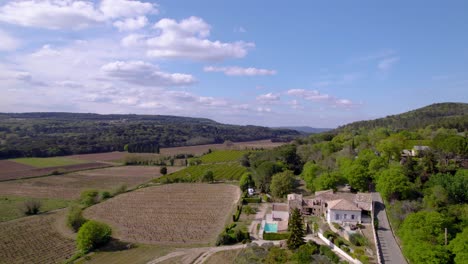 Aerial-view-of-Tresques-countryside-showcases-rolling-hills,-vineyards,-and-quaint-villages