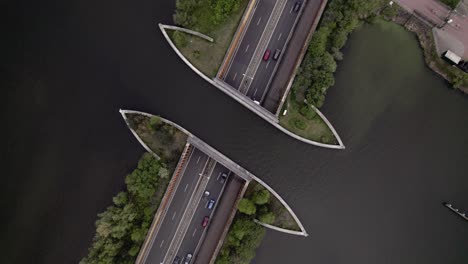 Highway-top-down-aerial-with-traffic-passing-underneath-Veluwemeer-aquaduct