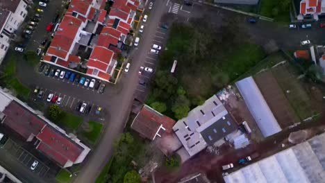 Hovering-above-small-town-rooftops,-illustrates-the-concept-of-urban-exploration-and-architectural-grandeur---pineapple-factory