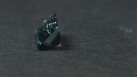 Polished-blue-gemstone-rotates-and-sparkles