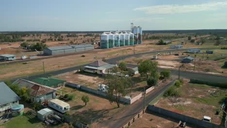 Roads-of-countryside-village-in-Queensland-Australia,-Iconic-Grain-Silos-Aerial-Drone-panoramic-shot,-daylight-clear-skyline-background