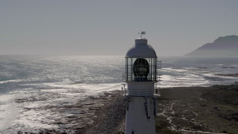 Slangkop-Lighthouse-UHD-Aerial-shot-in-Kommetjie,-Cape-Town