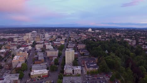 aerial-pan-across-a-city-on-the-bay-at-twilight-with-stormy-skies