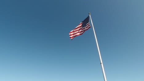 United-States-Flag-Against-Blue-Skies-at-the-Golden-Gate-Bridge-Vista-Point-South,-California,-USA