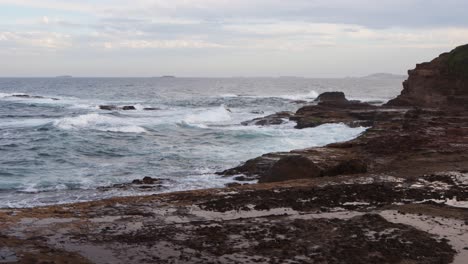 Rocky-Shore-with-waves-crashing-in-afternoon
