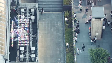 Directly-above-view-of-pedestrians-at-a-busy-area-of-Kyoto,-Japan