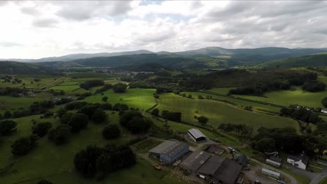 Machynlleth-sheep-farm-in-Wales-with-drone-video-wide-shot-panning-left-to-right