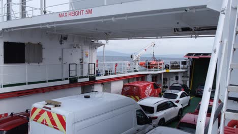 Passengers-vehicles-of-vans-and-cars-traveling-on-Caledonian-Macbrayne-Ferry-from-Barra-to-South-Uist-in-the-Outer-Hebrides-of-Scotland-UK