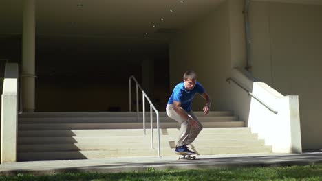 man-does-a-big-grind-on-a-hand-rail-on-their-skateboard