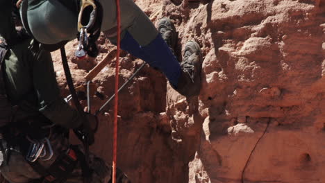 Researchers-on-rappel-at-sandstone-cliff,-home-of-lear's-macaw