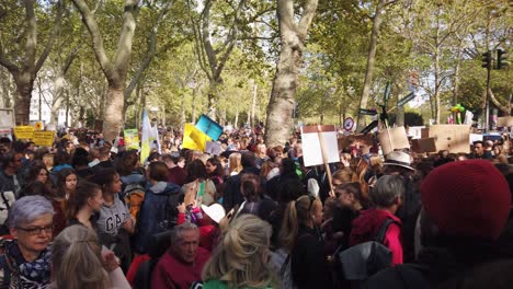 Huge-crowd-of-students,-teenagers-and-other-protesters-wait-in-the-street-for-a-Fridays-for-Future-demonstration-to-start