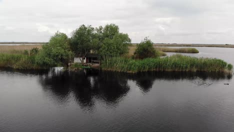Drone-footage-in-Danube-Delta-of-a-traditional-isolated-fishing-house
