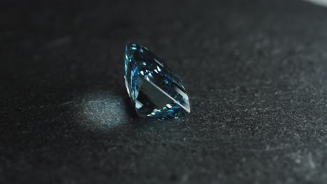 Polished-blue-gemstone-rotates-and-sparkles