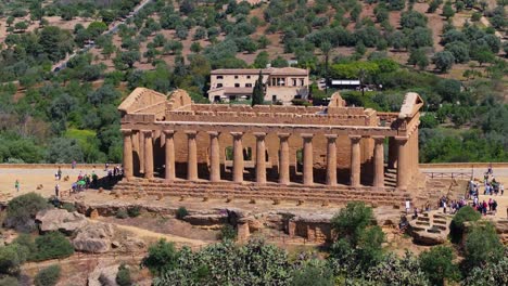 Backwards-Drone-Shot-Reveals-Temple-of-Concordia,-Agrigento,-Italy