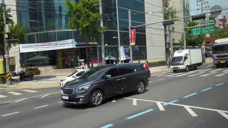 Shot-of-street-from-moving-bus-in-Seoul,-South-Korea