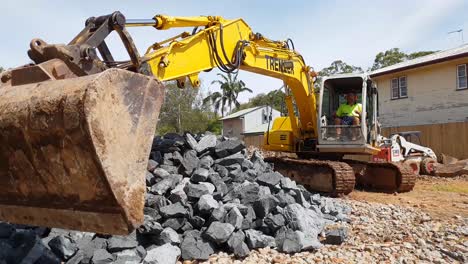 A-large-excavator-moving-quarry-material-on-a-construction-site