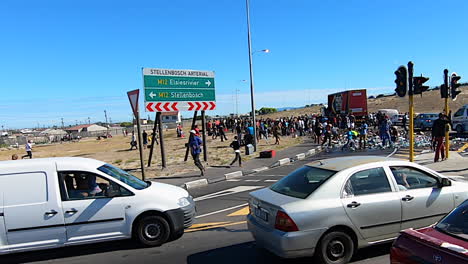 Locals-looting-and-ransacking-a-broken-down-beer-truck-near-a-squatter-village-in-Cape-Town-South-Africa