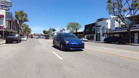 Toyota-Prius-Hybrid-driving-down-street