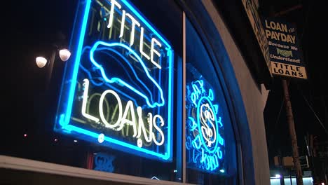 Neon-signs-light-up-a-fast-loans-center-in-Wilmington-Delaware