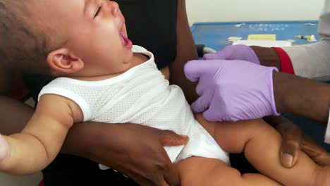 A-baby-is-vaccinated-with-an-injection-at-a-medical-clinic-in-Africa