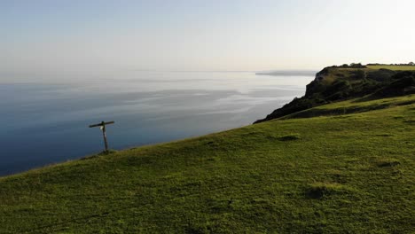 Aerial-Over-Parked-Silver-Car-On-Top-Of-Littlecombe-Shoot-Bay-During-Twilight